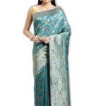 leeza store Women's Soft Silk Blend Banarasi Saree With Blouse Piece Feature Traditional Floral Patterns, Ethnic Motifs, And Golden Zari Pallu Patola Ethnic Motif